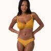 The Unlined Lace Bra: Turmeric 2 The Unlined Lace Bra: Turmeric -LuxeIntimates Store 1 on model front unlined lace bra turmeric